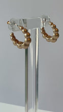 Load and play video in Gallery viewer, Golden Matte Hoop Earrings
